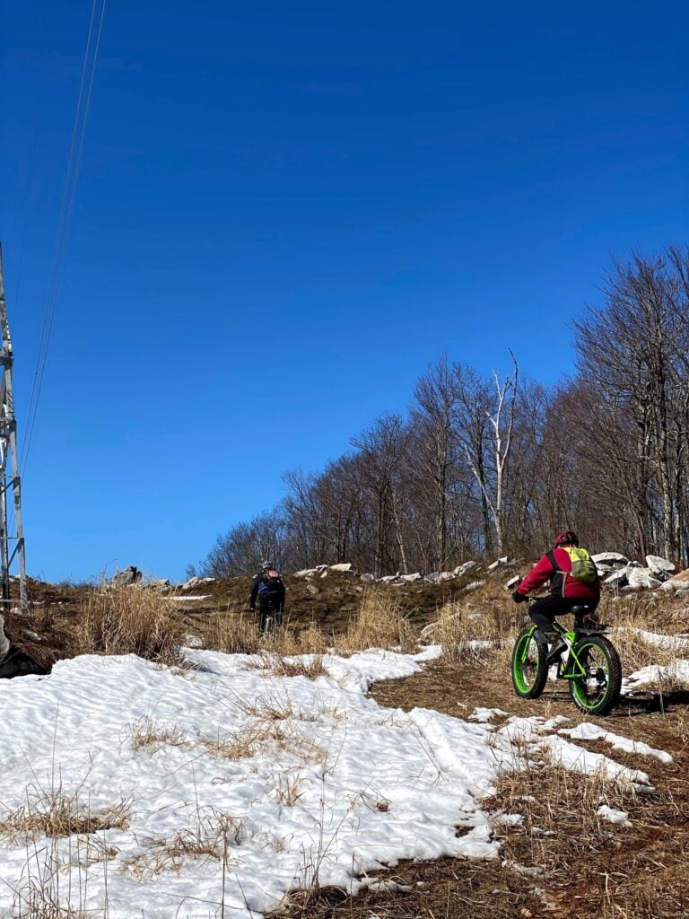 Fat bikes climbing past the last of the snow in Savage River State Forest